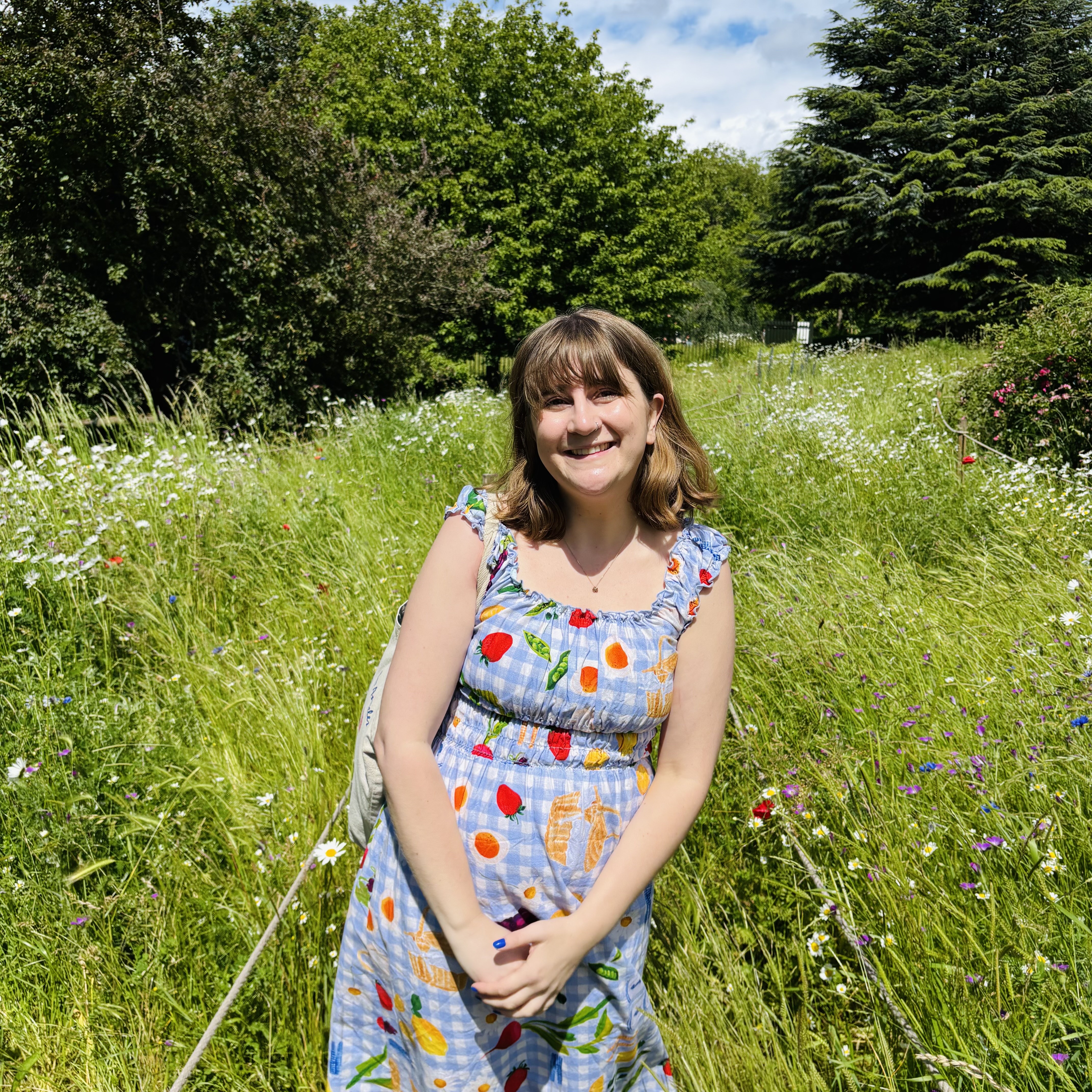 Tyanna in a field of flowers